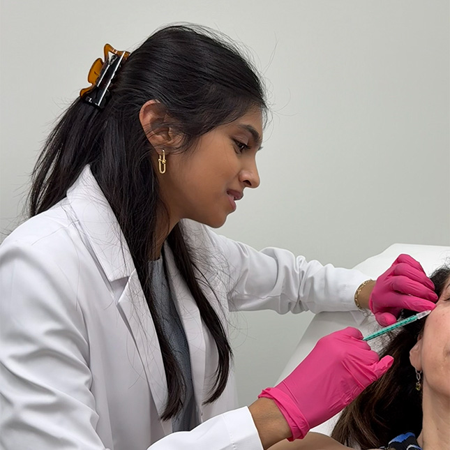 Dr. Leena Ramani injecting dermal filler at Palm Beach Skin & Hair Restoration