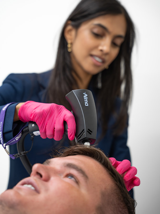 Dr. Leena Ramani using Alma machine for hair restoration