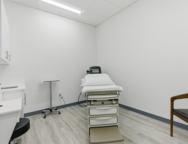 bed in consultation room at Palm Beach Skin & Hair Restoration in Jupiter, FL