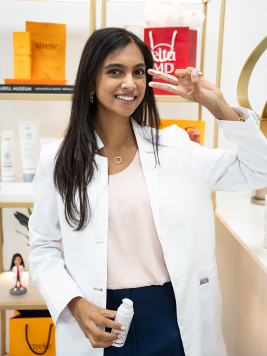 Dr. Leena Ramani showing her sunscreen application