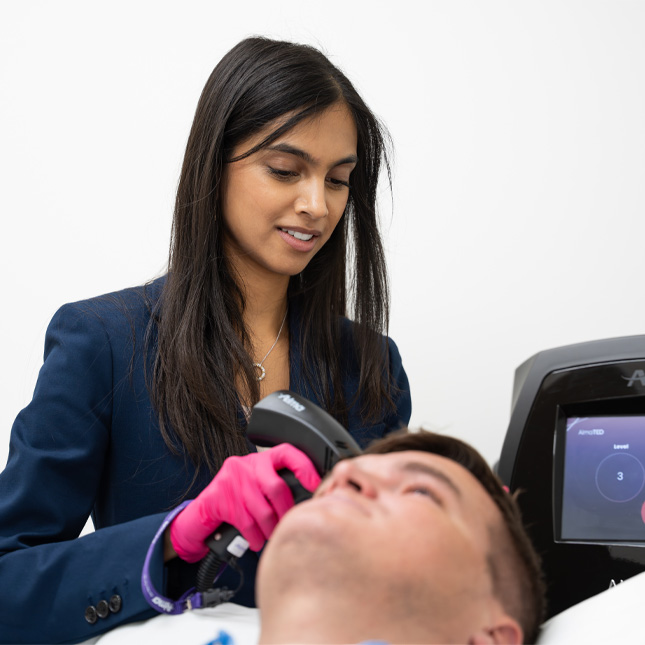 Dr. Leena Ramani offering male hair restoration to a client
