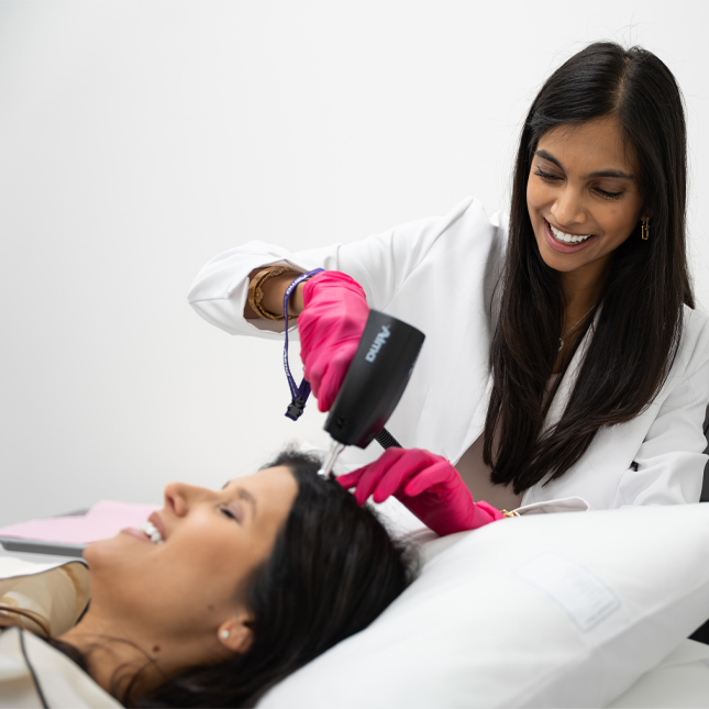Dr. Leena Ramani offering female hair restoration to a client